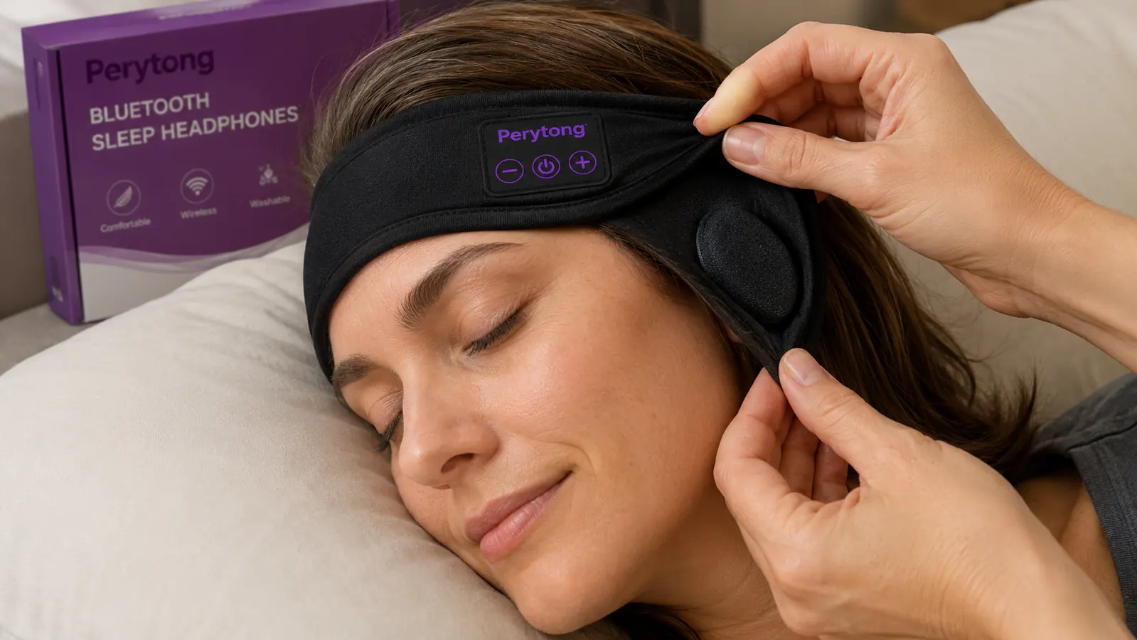 Close-up of a person adjusting a flat-speaker sleep headphone headband while lying on a pillow